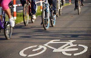Cyclists driving their bicycles in Long Beach.